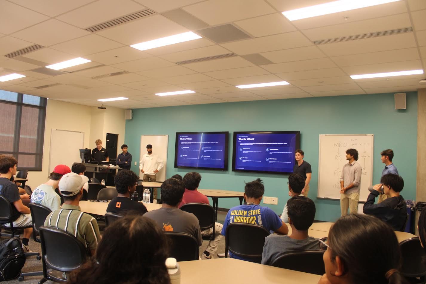 VITAL's executive board presenting "What is VITAL?" to a full classroom at the club callout
