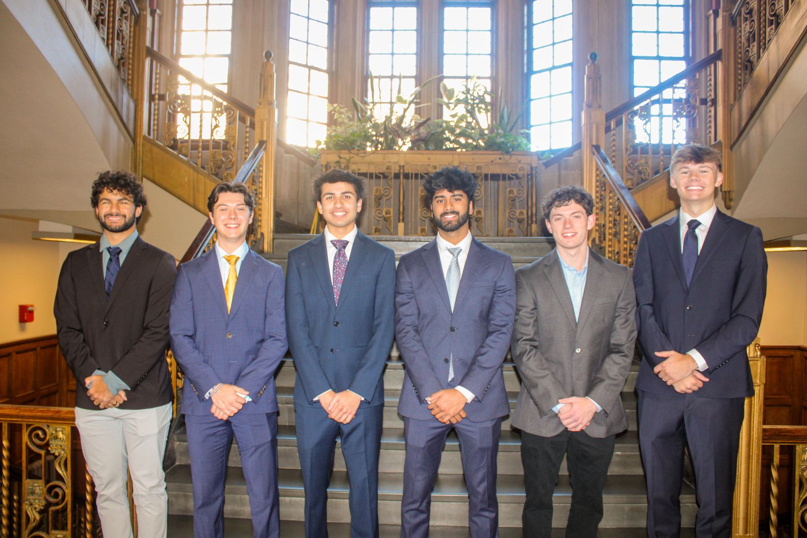 The six members of VITAL's executive board standing together on a staircase